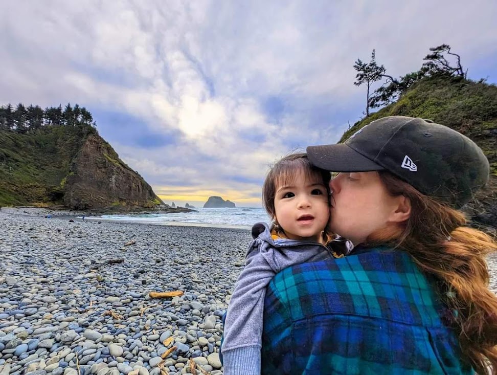 Kate at the coast with Kaia